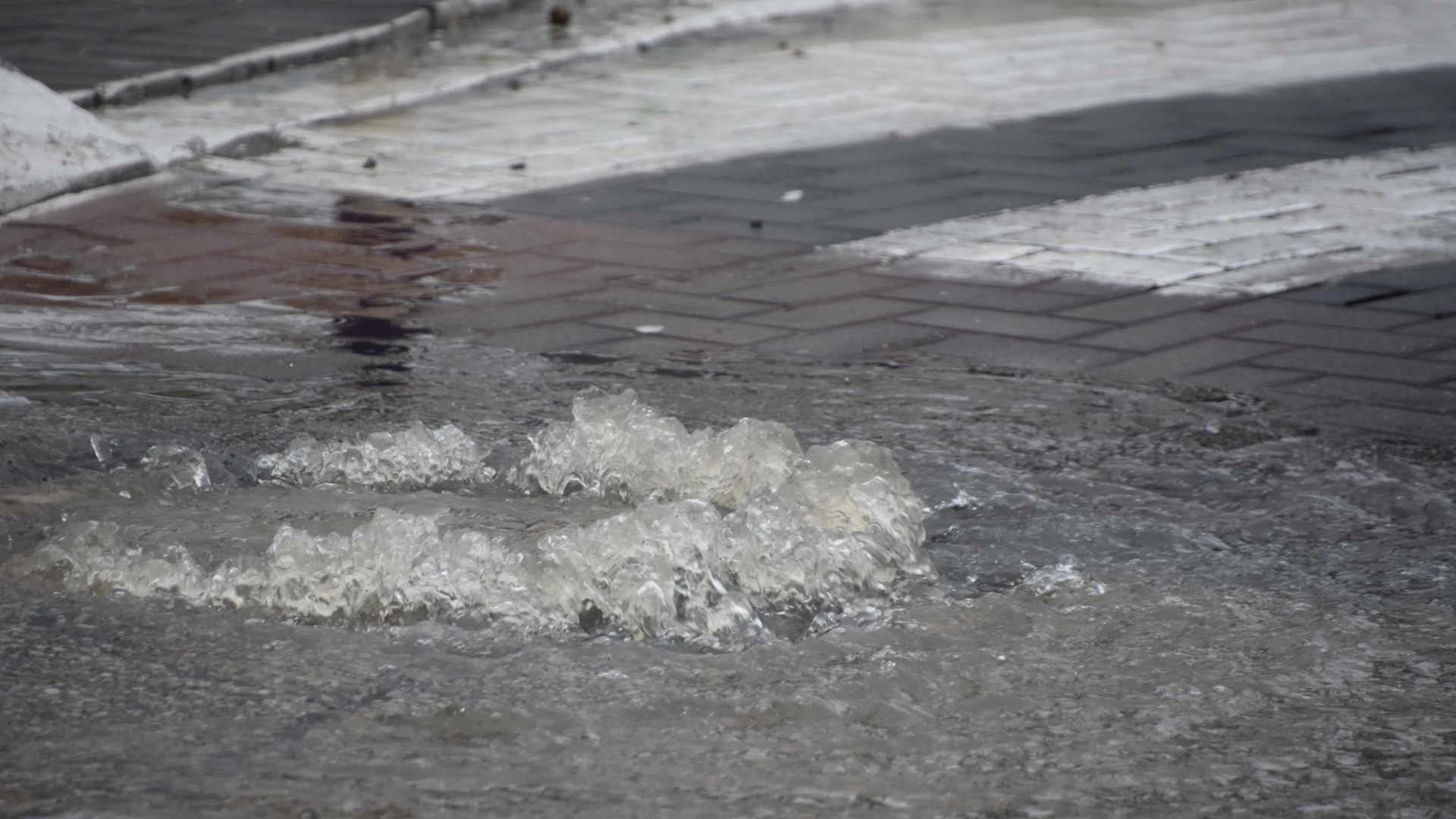 Image of a sewer overflow coming out of the ground