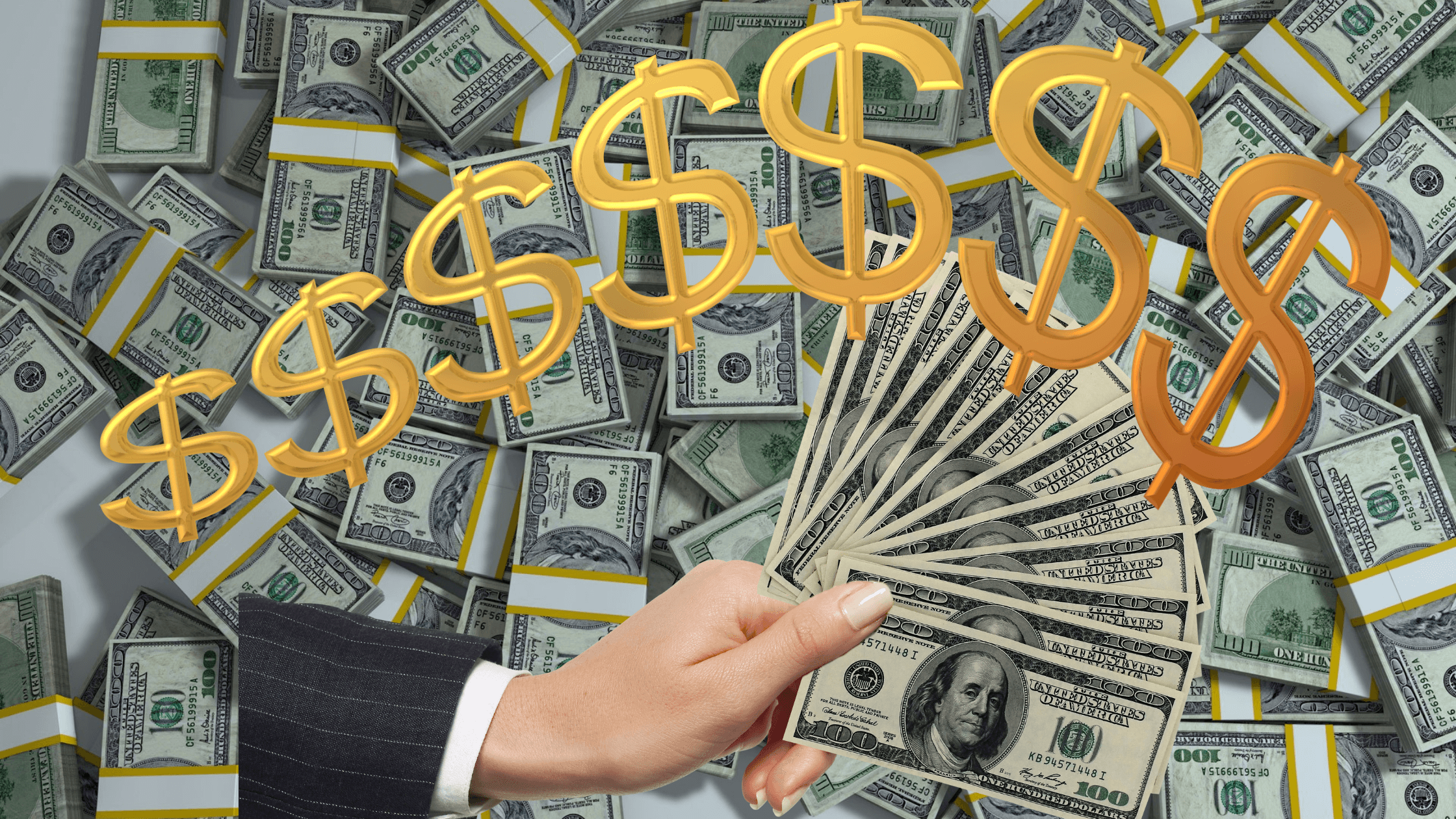 Stacks of $100 bills with gold dollar signs, and a hand holding a few bills